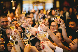 Guests enjoying a toast in our event hall